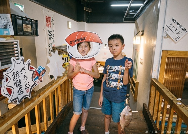 Just One Cookbook children with fish caught at Zauo Shinjuku ざうお新宿店 - Shinjuku Travel Guide | justonecookbook.com