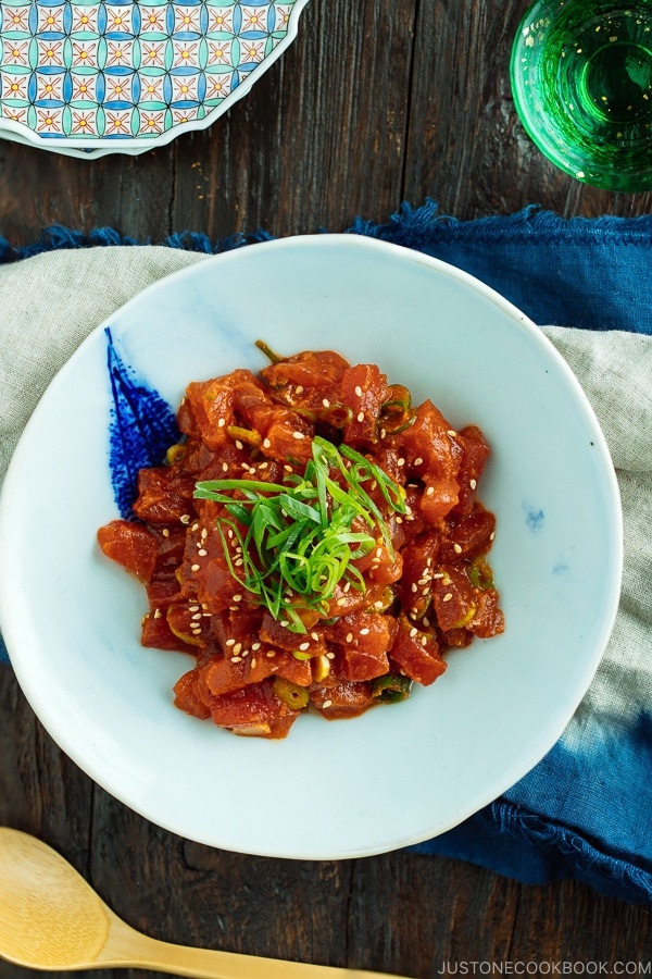 Spicy Tuna served in a bowl with scallion on top.