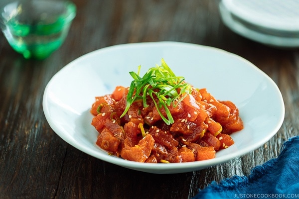 Spicy Tuna served in a bowl with scallion on top.