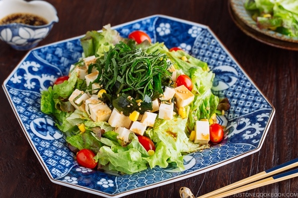 Refreshing Tofu Salad with Sesame Ponzu Dressing on a Japanese blue platter.