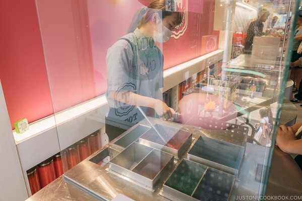staff making giant cotton candy at Rainbow sweets Harajuku - Harajuku Travel Guide | www.justonecookbook.com