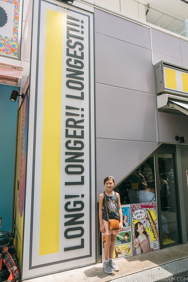 Just One Cookbook child next to long longer longest store sign - Harajuku Travel Guide | www.justonecookbook.com
