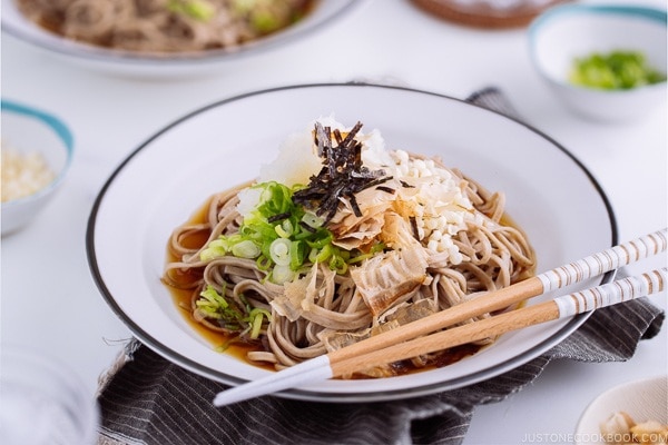 Oroshi soba served in dashi based sauce topped with grated daikon, bonito flakes, and scallion.