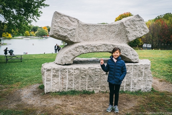 child pose in front of sculpture at Mount Royal Park - Montreal Travel Guide | www.justonecookbook.com