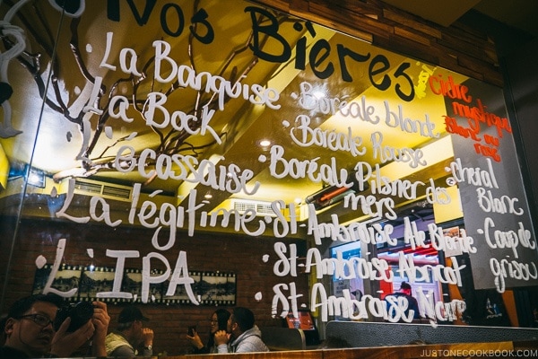 beer names on a mirror at La Banquise - Montreal Travel Guide | www.justonecookbook.com