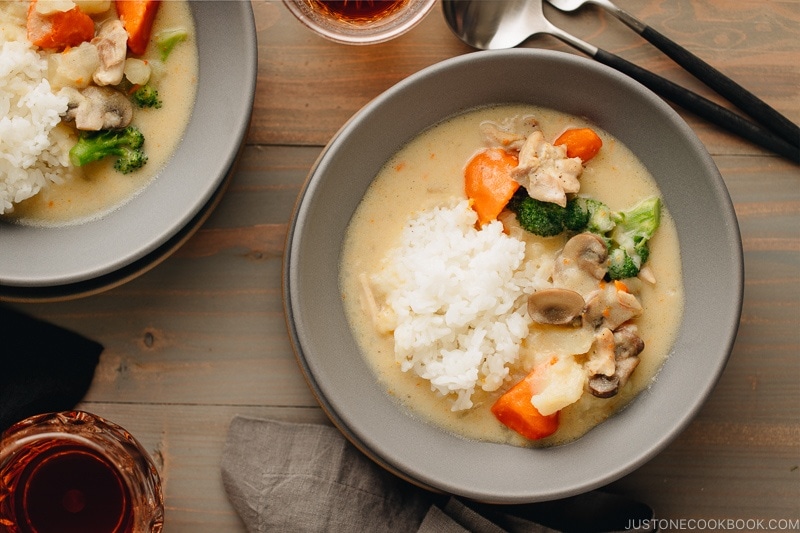 A gray bowl containing Japanese Cream Stew (White Stew) with chicken and vegetables in a savory thick white sauce.