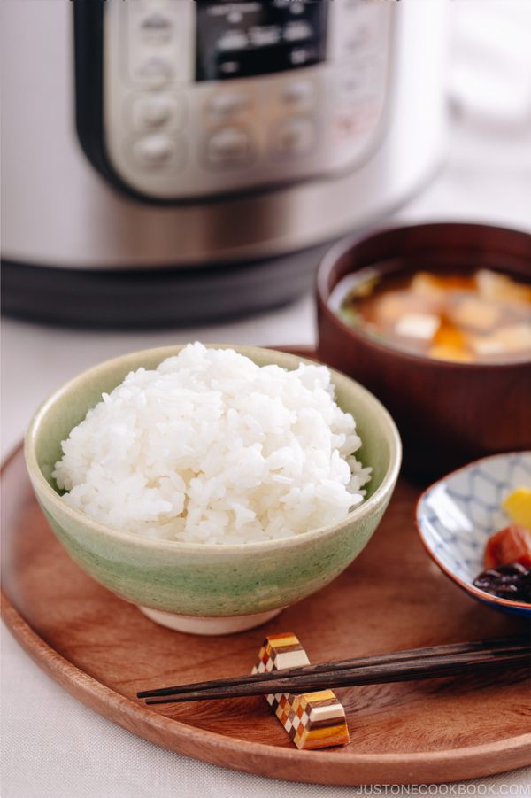 Perfectly cooked rice served in a rice bowl along with miso soup.