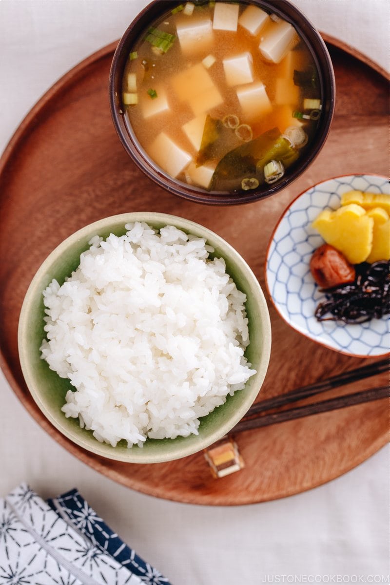 Perfectly cooked rice served in a rice bowl along with miso soup.