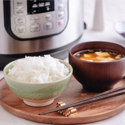 Perfectly cooked rice served in a rice bowl along with miso soup.