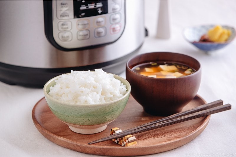 Perfectly cooked rice served in a rice bowl along with miso soup.