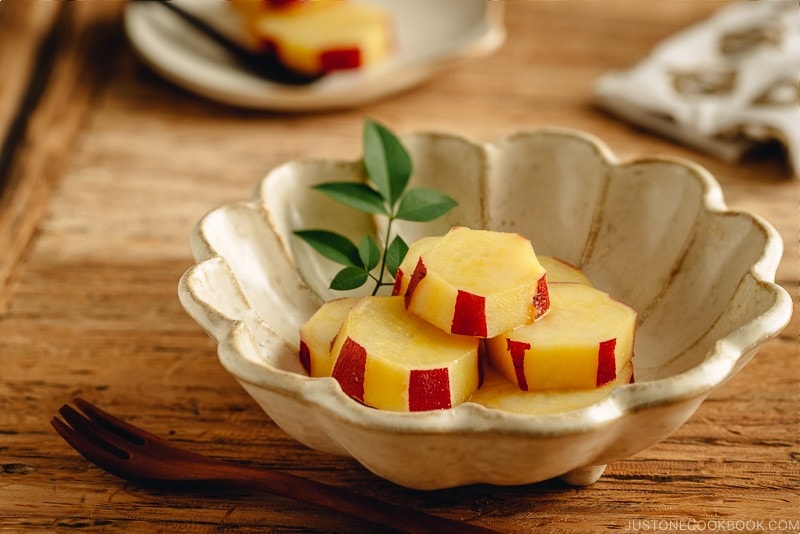 Fluted bowl containing Simmered Japanese Sweet Potatoes with Lemon.