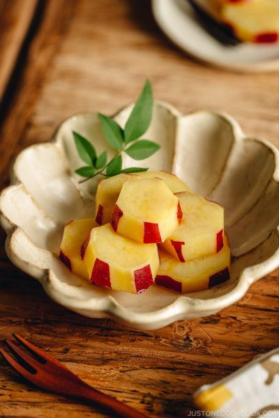 Fluted bowl containing Simmered Japanese Sweet Potatoes with Lemon.