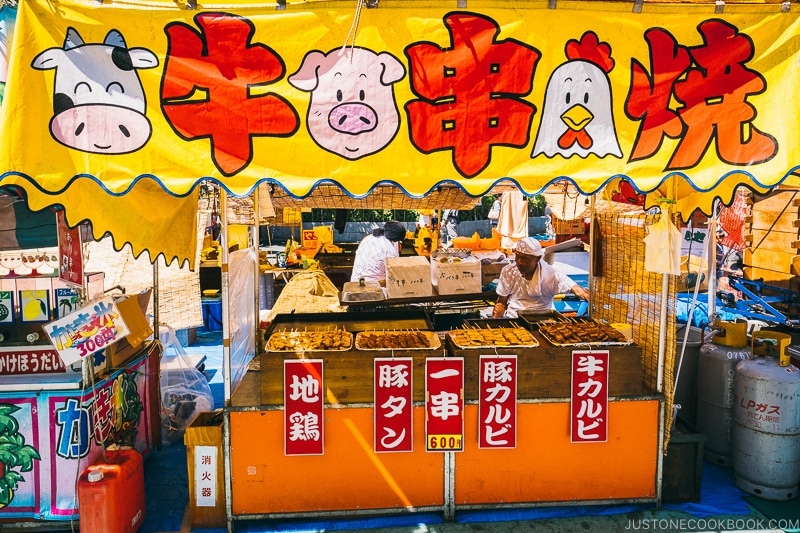 summer festival food stall vendor selling meat skewers - Tokyo Asakusa Travel Guide | www.justonecookbook.com