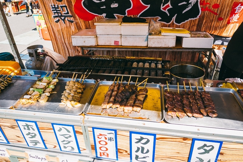 summer festival food stall vendor selling meat skewers - Tokyo Asakusa Travel Guide | www.justonecookbook.com