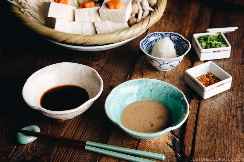 Ponzu sauce and sesame sauce are served for shabu shabu (Japanese hot pot) meal. Garnish with grated daikon, green onion, or Japanese chili peppers.