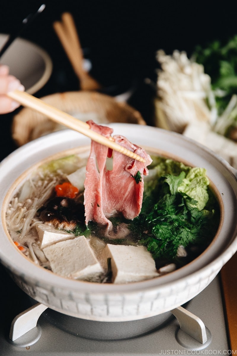 Cook thinly sliced well-marbled beef in a shabu shabu hot pot.