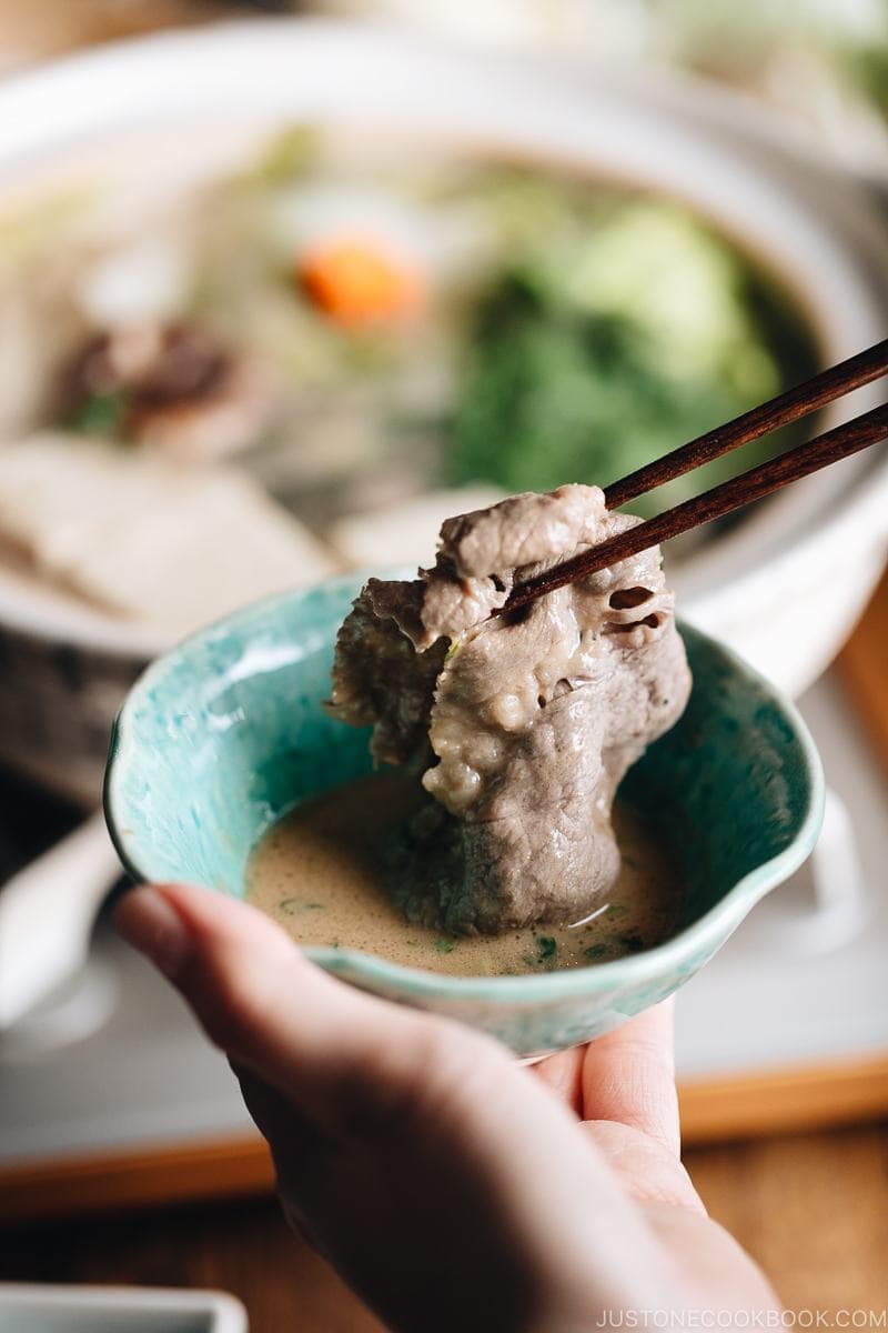 Dip your cooked shabu shabu ingredients in sesame sauce and enjoy!