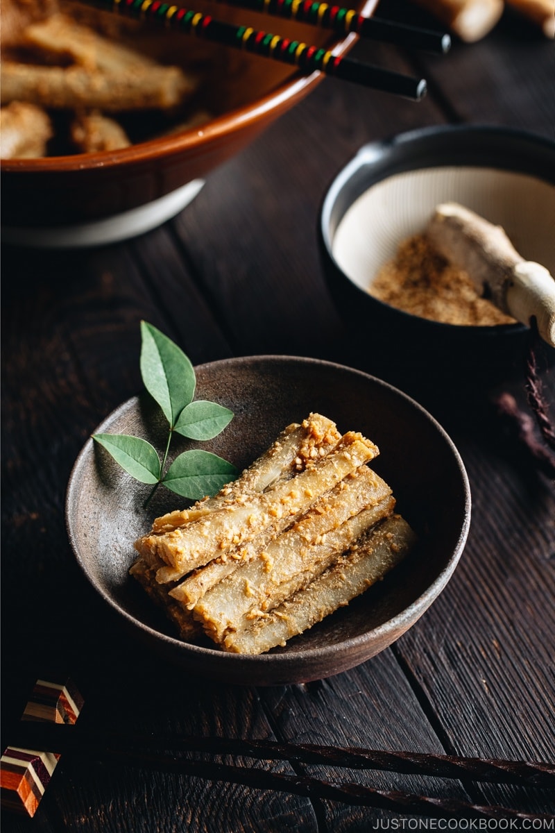 A Japanese bizen bowl containing Pounded Burdock Root with Sesame Sauce (Tataki Gobo).