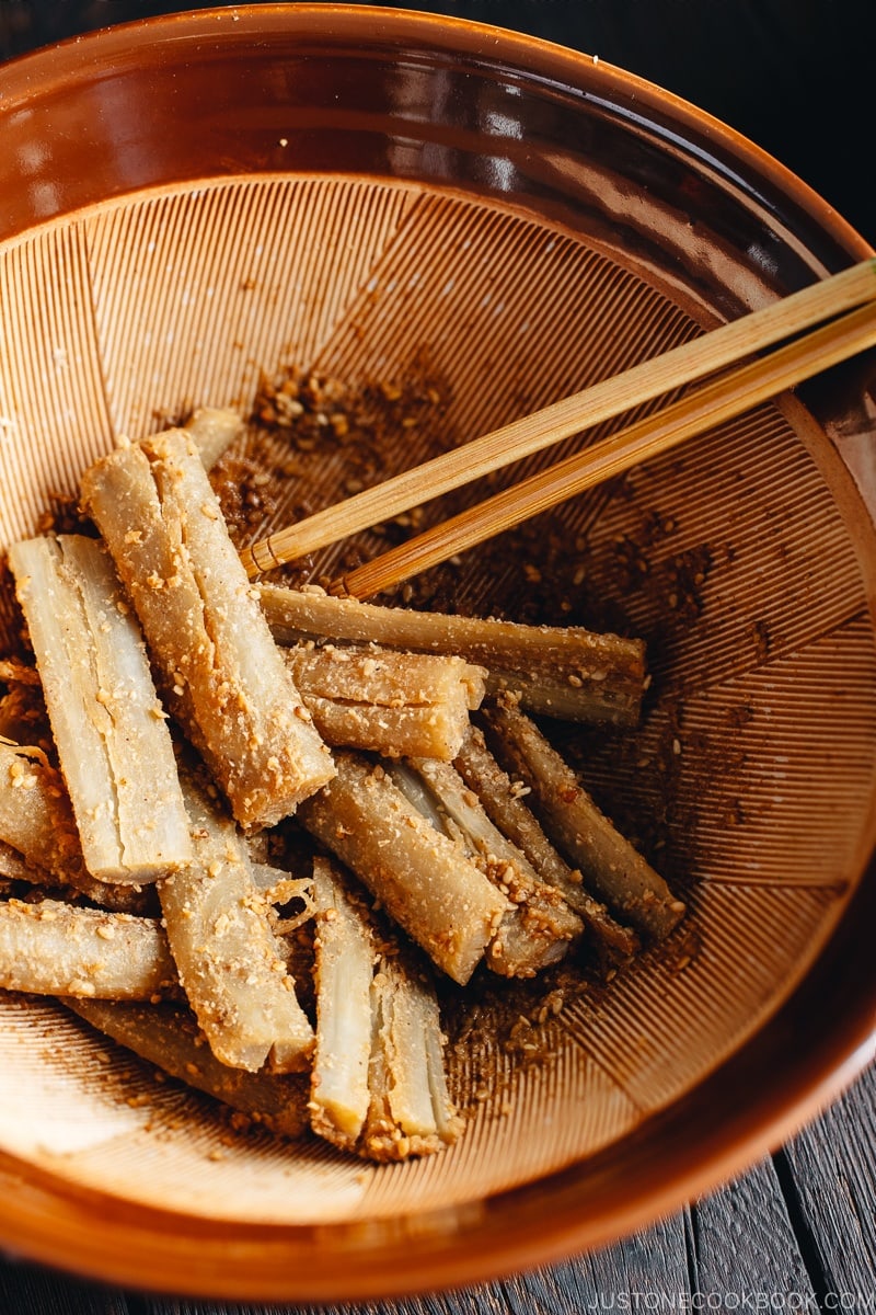 A Japanese mortar (suribachi) containing Pounded Burdock Root with Sesame Sauce (Tataki Gobo).