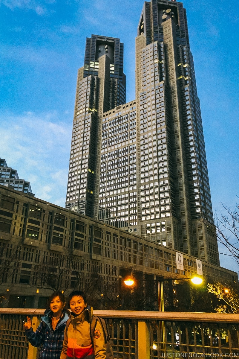 children in front of Tokyo metropolitan government building getting ready to board the ski bus - Hakuba Travel and Ski Guide | www.justonecookbook.com