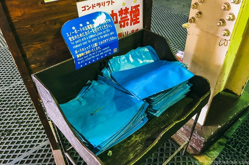 snowboard covers for use inside the gondola at Tsugaike Ski Resort - Hakuba Travel and Ski Guide | www.justonecookbook.com