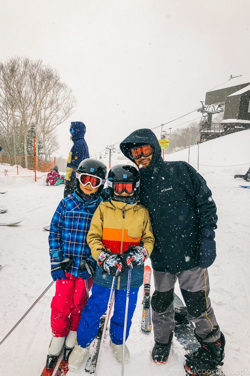 people getting to ski at the top of gondola at Tsugaike Ski Resort - Hakuba Travel and Ski Guide | www.justonecookbook.com