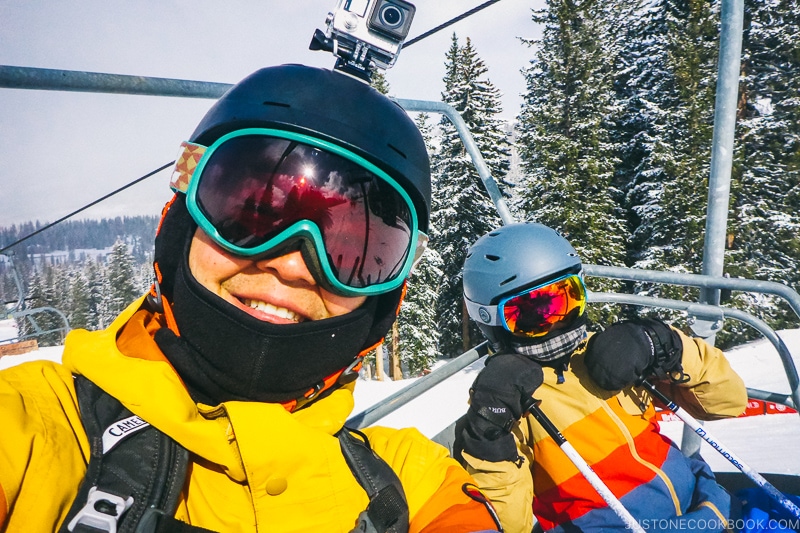 Mr. JOC and child on ski lift at Brighton Resort - Ski Vacation Planning in Utah | www.justonecookbook.com