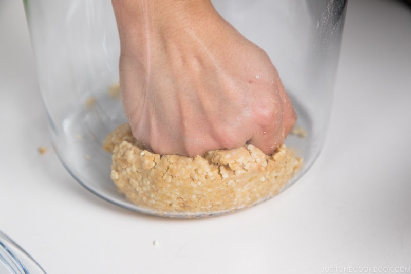 press down soybeans as firmly as possible to remove any air pockets.