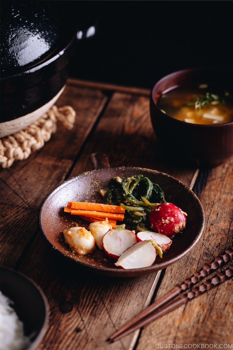Carrot, radish, and garlic misozuke (miso pickles) in a brown ceramic.