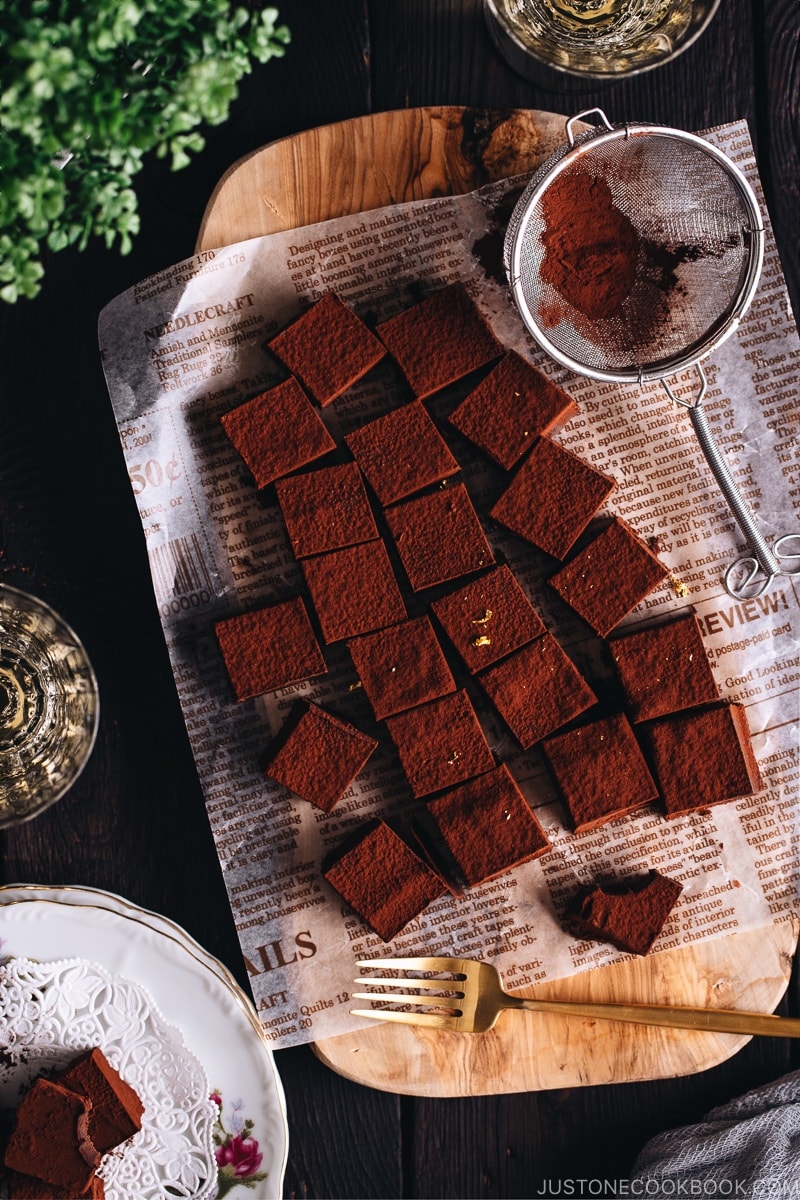 Rich and smooth Nama Chocolate on a wooden board.