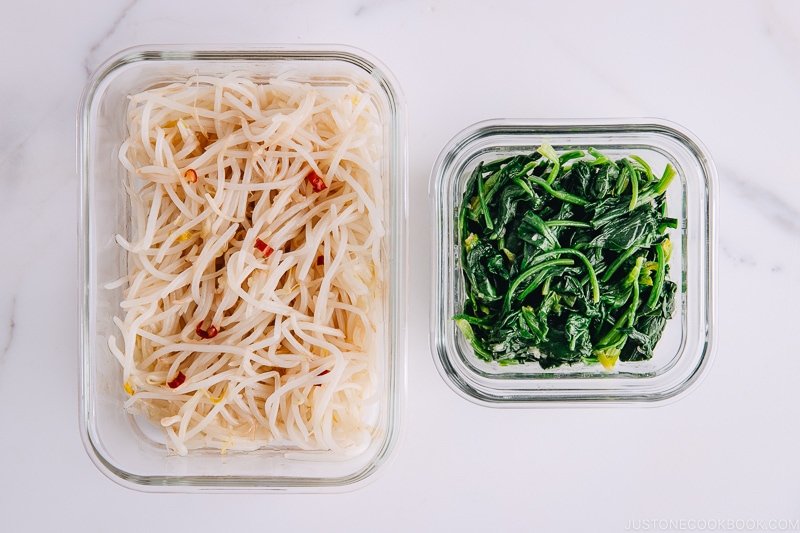 Spinach and Bean Sprout Namul in glass containers.