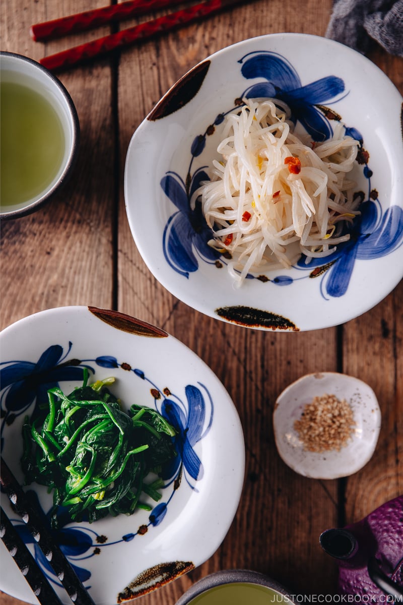 Spinach Namul and Bean Sprout Namul in blue flower pattern dishes