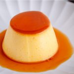 Silky soft and creamy Instant Pot Kabocha Flan on a white plate.