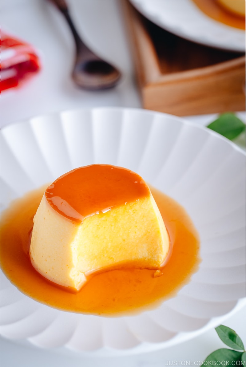 Smooth and creamy Kabocha Instant Pot flan on a white plate.