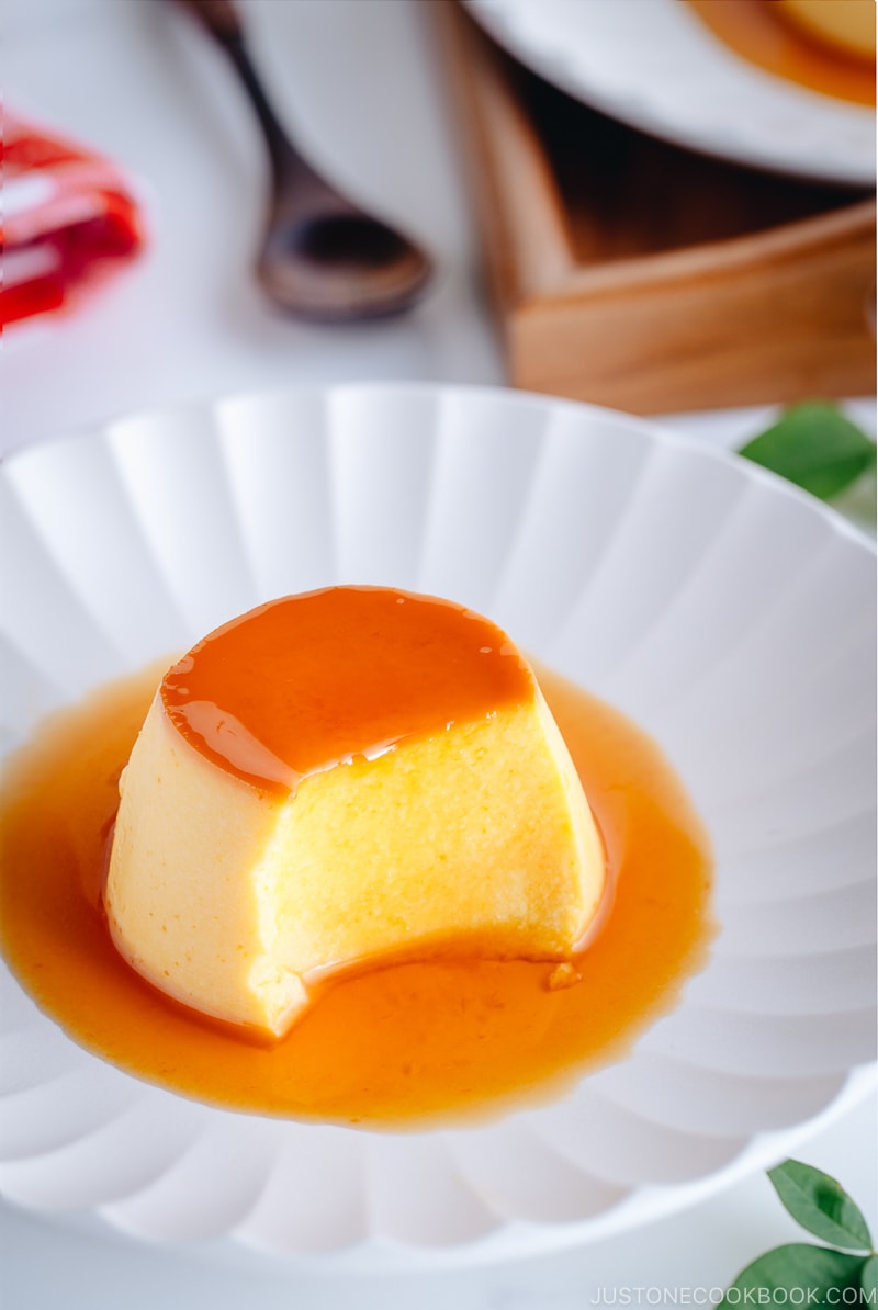 Silky soft and creamy Instant Pot Kabocha Flan on a white plate.