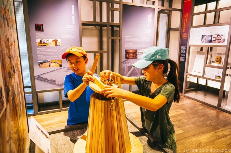 children working with tools for making tile at Nara Palace - Nara Guide: Historical Nara Temples and Shrine | www.justonecookbook.com