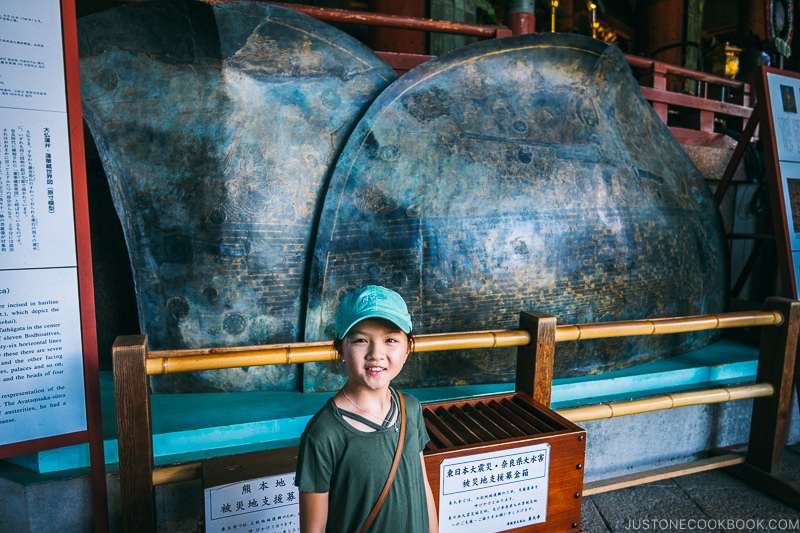 child standing in front of lotus petal replicate inside Daibutsuden - Nara Guide: Todaiji | www.justonecookbook.com