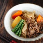 Pressure Cooker Instant Pot Nikujaga (Japanese Meat and Potato Stew) in a white bowl.