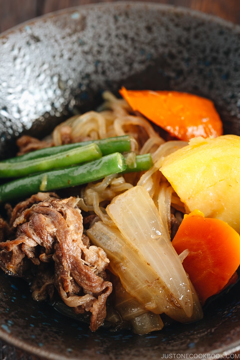 Pressure Cooker Instant Pot Nikujaga (Japanese Meat and Potato Stew) in a black bowl.