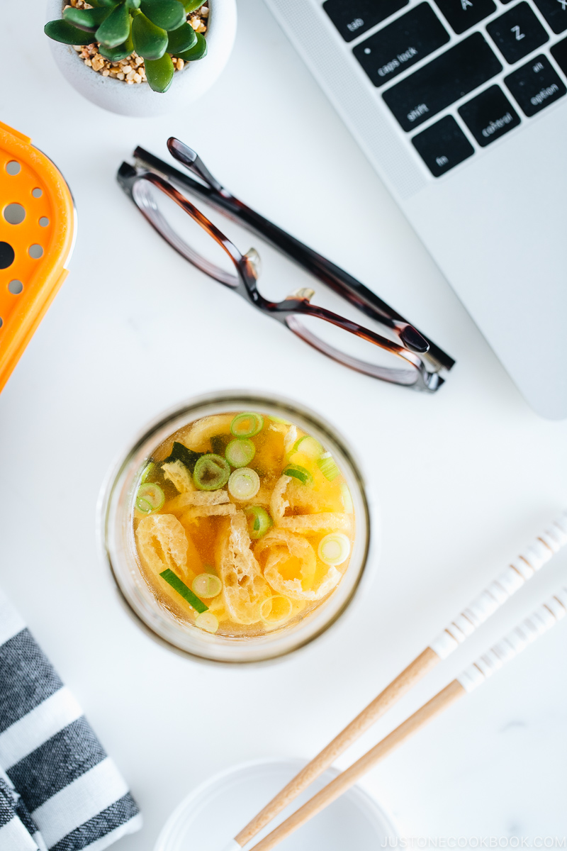 Homemade instant miso soup in a mason jar on the office desk.