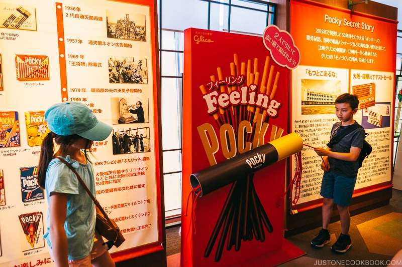 children playing with Pocky display - Osaka Guide: Tsutenkaku and Shinsekai District | www.justonecookbook.com