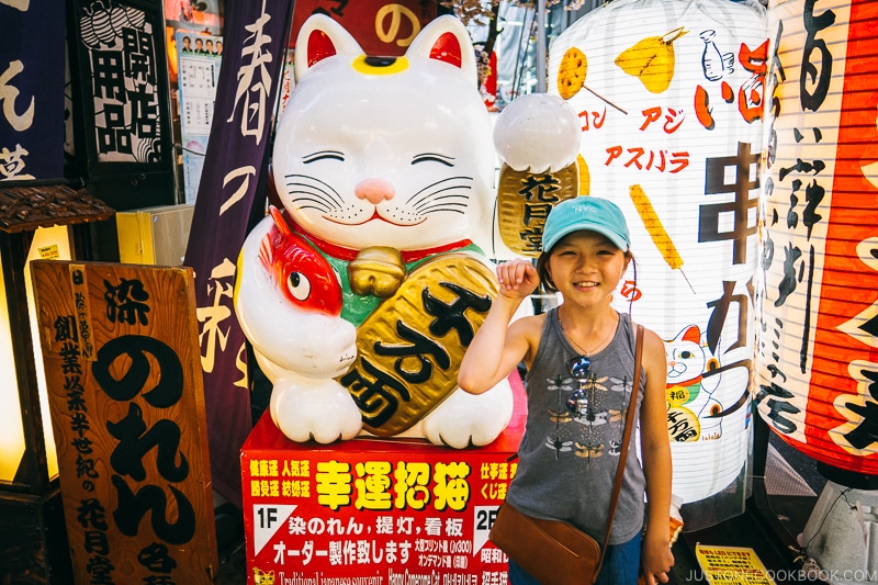 child in front of signage store - Osaka Guide: Kuromon Ichiba Market and Kitchenware Street | www.justonecookbook.com