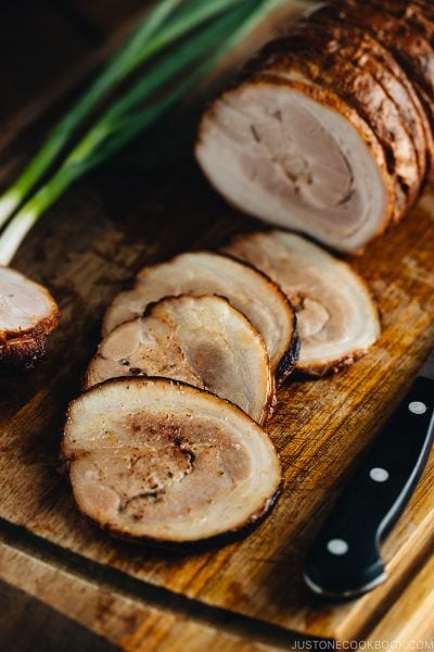 Thin slices of Chashu on the cutting board.