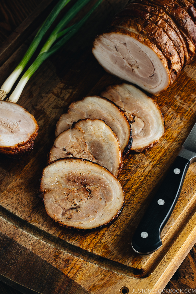 Thin slices of Chashu on the cutting board.