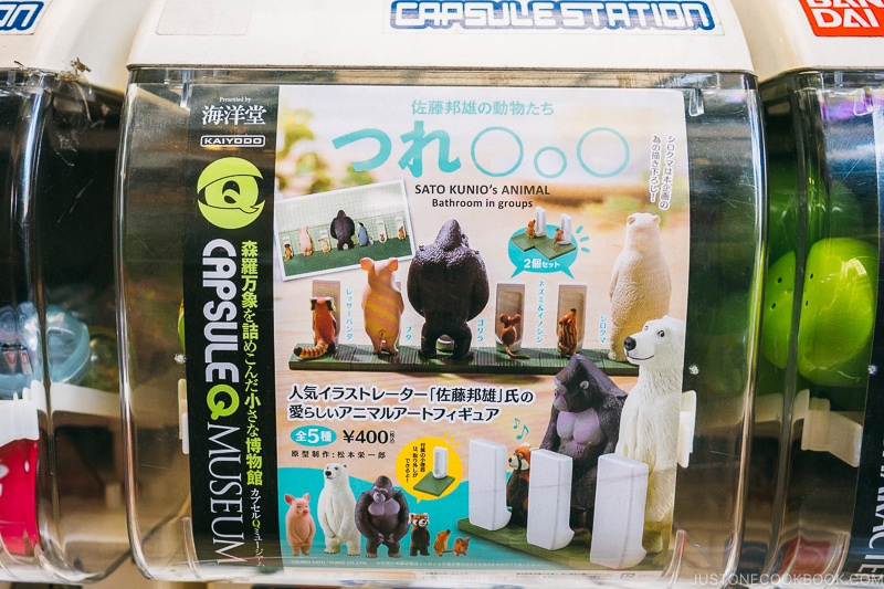 animal standing at a urinal by Kunio Sato inside gashapon machine - Osaka Guide: Amerikamura & Shinsaibashi Shopping Street | www.justonecookbook.com