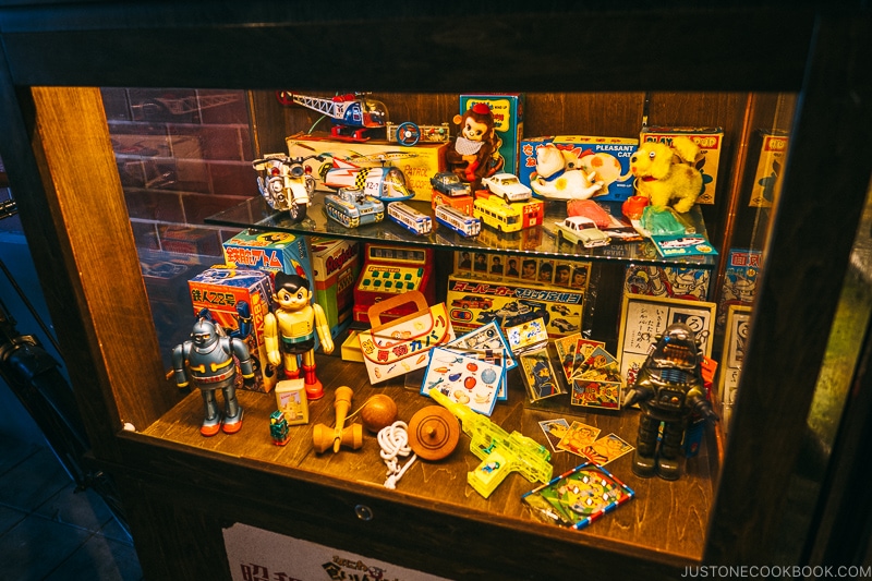 Japanese toys from 1960s inside display case at Naniwa Kushinbo Yokocho - Osaka Guide: Tempozan Harbor Village | www.justonecookbook.com