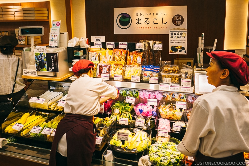 worker arranging food in depachika - Osaka Guide: Umeda | www.justonecookbook.com