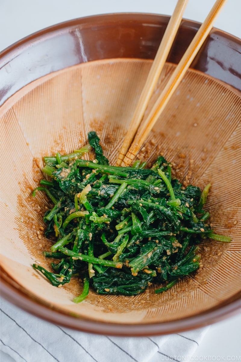 Spinach with sesame miso sauce in a Japanese mortar and pestle.