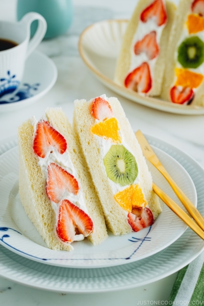 Japanese fruit sandwiches on a plate. Served with coffee.