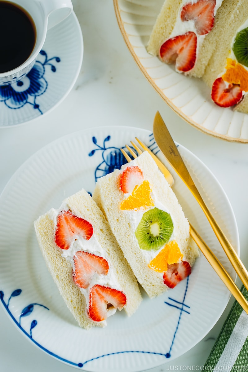 Japanese fruit sandwiches on a plate. Served with coffee.